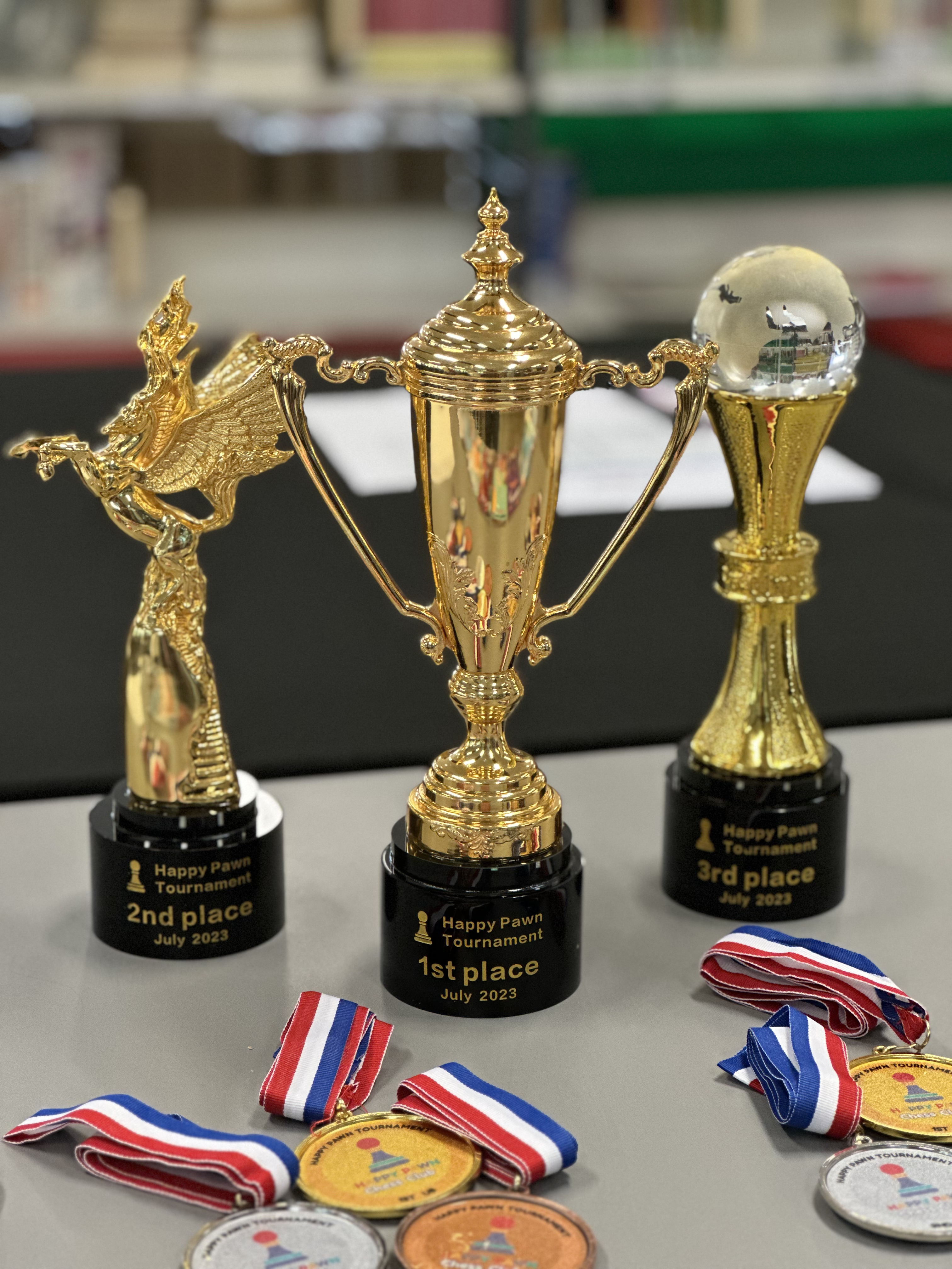 Trophies and medals awarded at Happy Pawn tournaments
