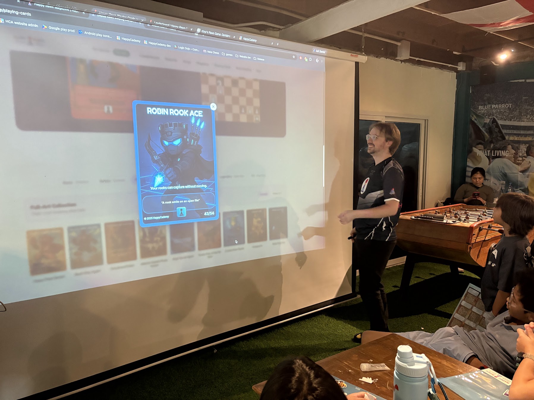 Coach presenting the Happy Pawn playing cards collection